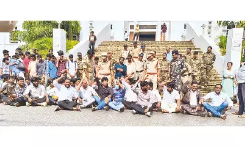 Activists of SC, ST, BC and Minority organisations staging a dharna before SVU Administrative building in Tirupati on Tuesday
