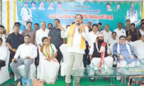 Minister for Agriculture Tummala Nageshwar Rao addressing the gathering after laying foundation stone for integrated school in Chilkur