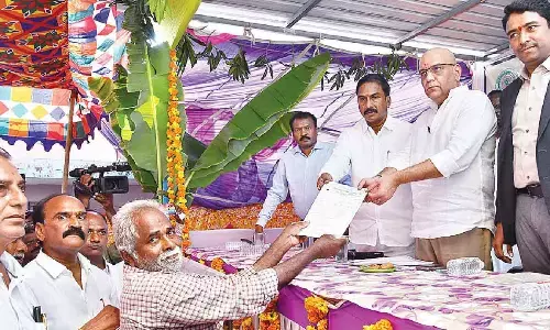 Special Chief Secretary (Revenue) RP Sisodia receives petition from a villager at a Revenue Sadassu held at Takkellapadu village in Jaggaiahpet mandal in NTR district on Friday