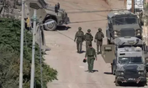 Israeli army calls up extra forces near Syrian border