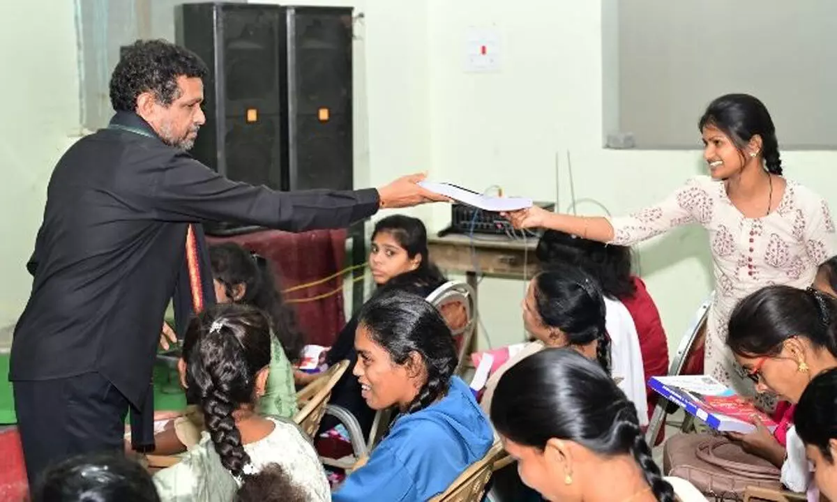 Narender Reddy distributes study material to students