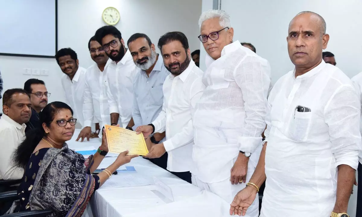 TDP leader Sana Satish Babu reciev-ing the certificate of election from the returning of-ficer on Friday