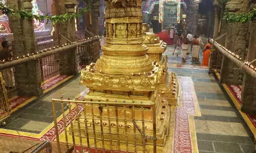 Hill shrine shines under glow of ghee lit lamps