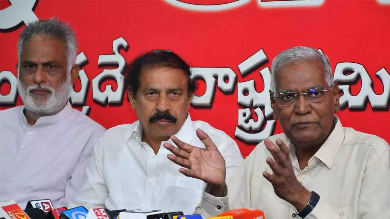 CPI general secretary D Raja, state secretary K Ramakrishna and party leaders addressing a press conference at party state office NR Dasari Bhavan in Vijayawada on Tuesday (Photo: Ch Venkata Mastan)