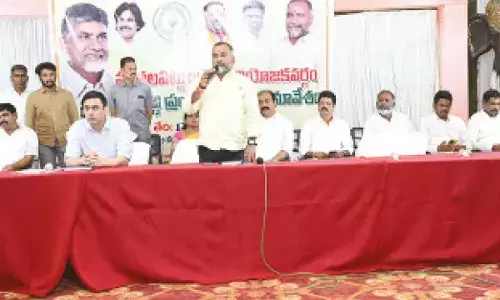 Puthalapattu MLA K Murali Mohan speaking at the constituency review meeting in Ka-nipakam on Tuesday. Collector Sumit Kumar and other officials are also seen.