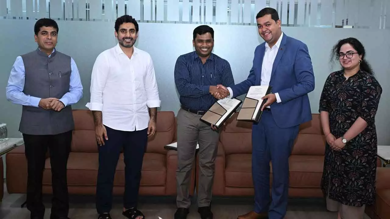 Representatives of Tony Blair Institute and HRD ministry sing MoU in the presence of HRD minister Nara Lokesh at Undavalli on Friday