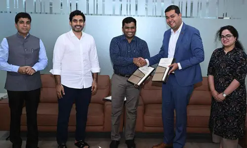 Representatives of Tony Blair Institute and HRD ministry sing MoU in the presence of HRD minister Nara Lokesh at Undavalli on Friday