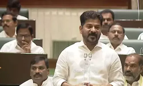 Revanth Reddy Proposes Installation of Manmohan Singhs Statue in Financial District