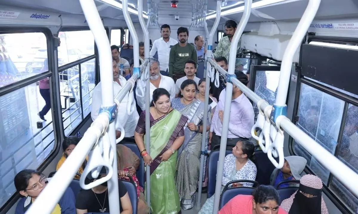 AP ministers enquiring with women passengers about free travel in Bangalore RTC bus on Friday