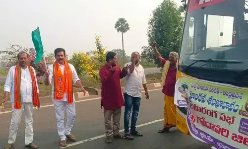 BJP leader Kambala Srinivas Rao flagging off buses heading to the Haindava Sankharavam public meeting