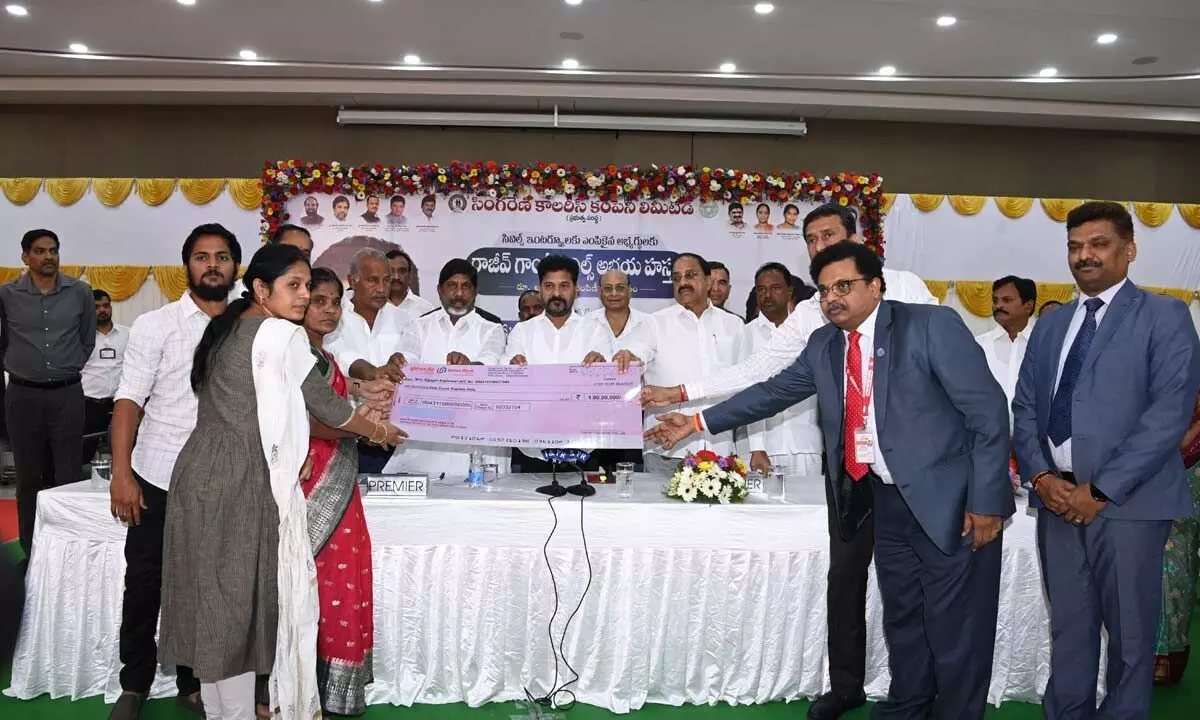 Chief Minister Revanth Reddy distributing Rs 1 lakh cheques to Civil Services aspirants under Rajiv Gandhi Civil Services Abhaya Hastam in the city on Sunday