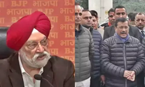 Kejriwal tells slum dwellers voting for BJP amounts to suicide; Hardeep Puri hits back