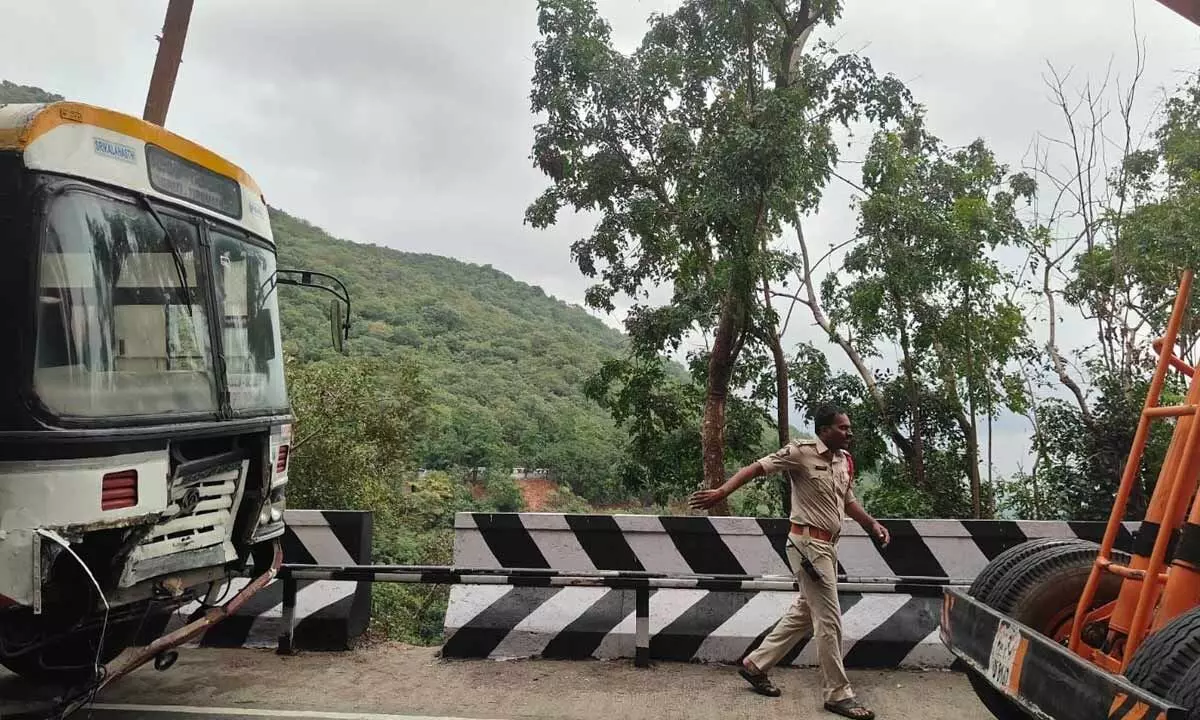 Traffic on Tirumala ghat road hit as RTC bus rams divider