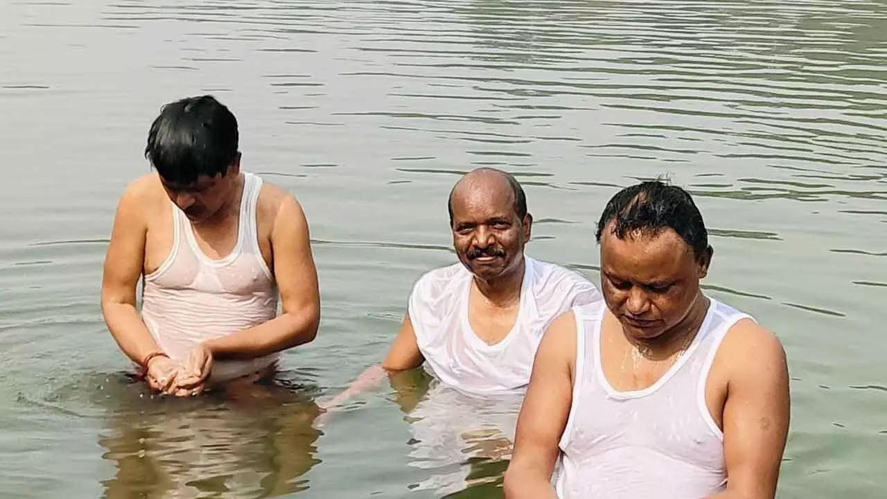 Majhi takes holy dip in Baitarani on Makar Sankranti