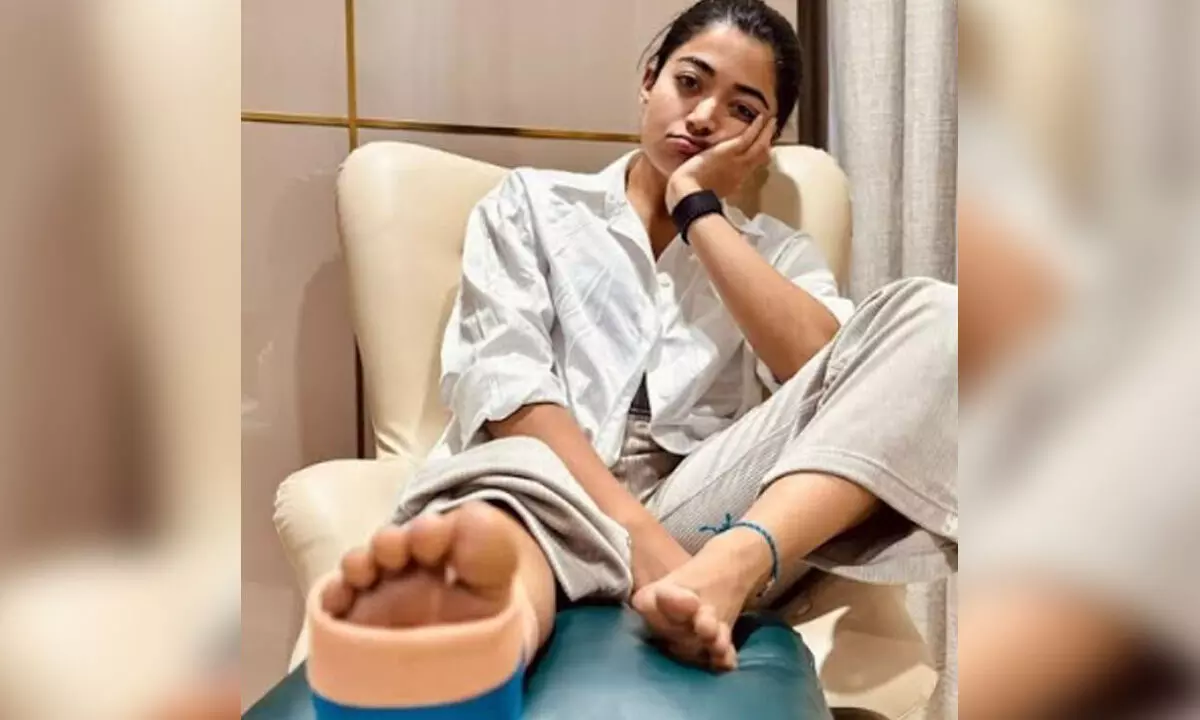 Rashmika spotted at Hyderabad airport in wheelchair after leg injury Rashmika spotted at Hyderabad airport in wheelchair after leg injury