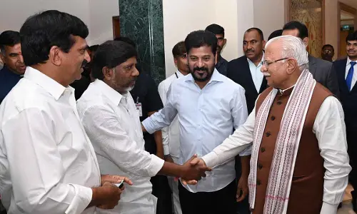 Chief Minister Revanth Reddy introducing Deputy Chief Minister Mallu Bhatti Vikramarka to Union Minister for Housing Manohar Lal Khattar while State Revenue Minister Ponguleti Srinivas Reddy looks on, in Hyderabad on Friday
