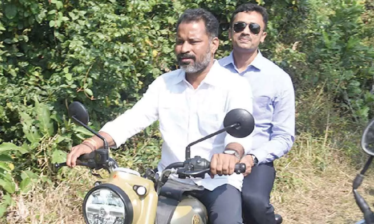 Collector visits Gummidi Gedda on bike Collector visits Gummidi Gedda on bike