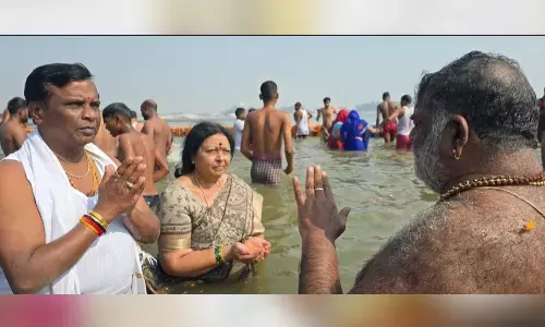 Dhanpal family takes holy dips in Sangam