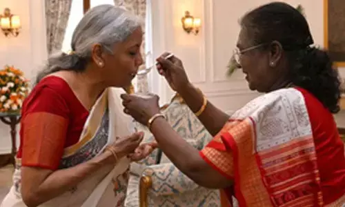 President Murmu feeds customary dahi-cheeni to FM Sitharaman