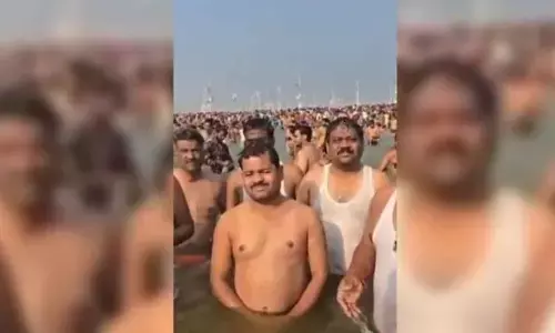 Contractors take holy dip at Sangam, pray for clearance of pending bills