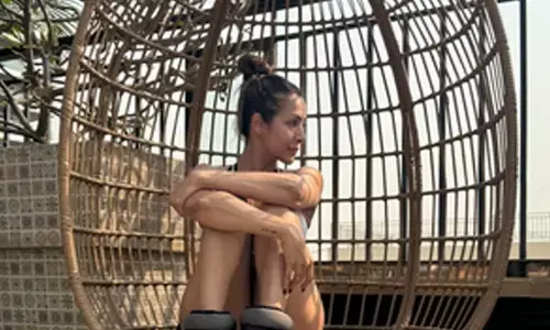 Malaika Arora starts her day with yoga, sunshine and her furry friend