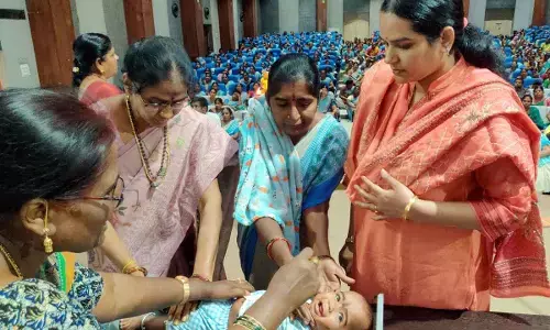 Kurnool Joint Collector Dr B Navya checking the weights of the newborn babies