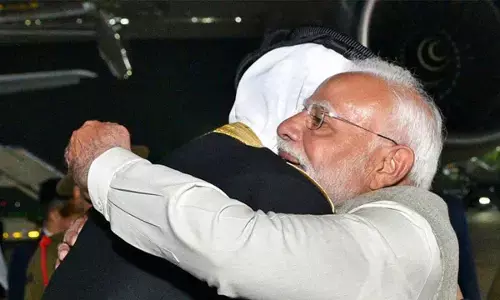 Prime Minister Narendra Modi receives The Amir of the State of Qatar Sheikh Tamim Bin Hamad Al-Thani upon his arrival in India, in New Delhi on Monday