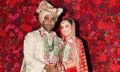 Aadar Jain and Alekha Advani Shine in Red and Ivory at Their Dreamy Wedding