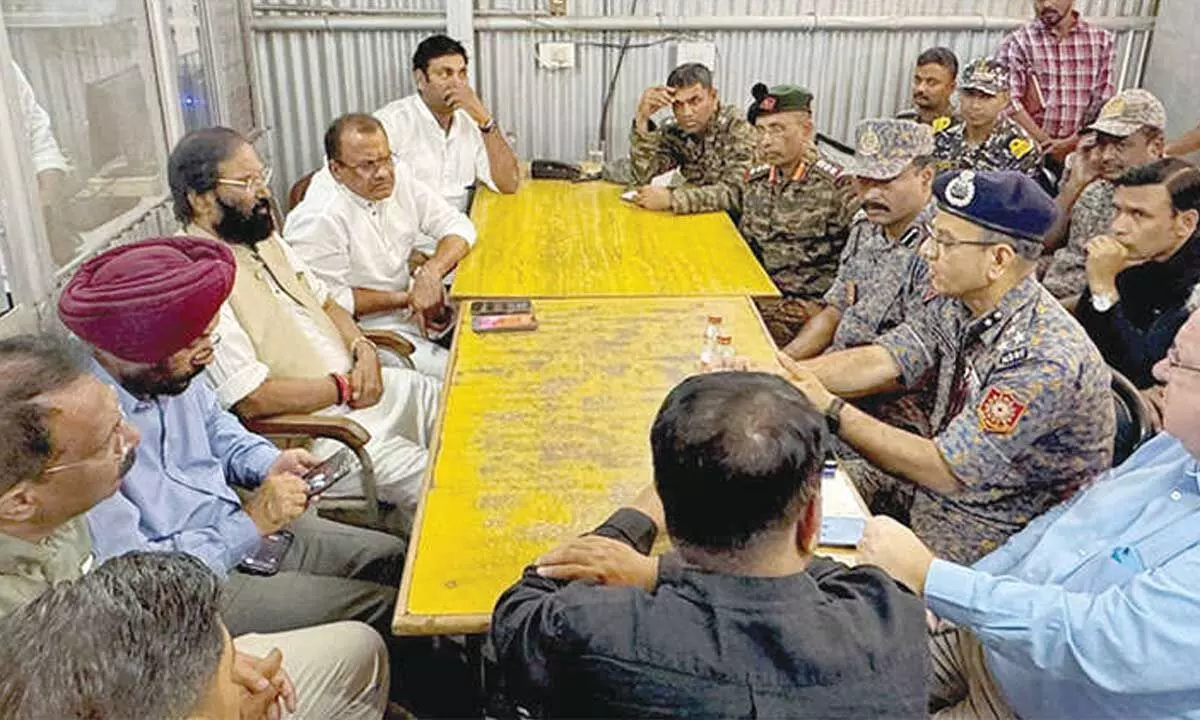 Debris halts efforts to reach trapped workers