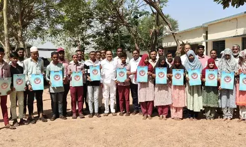 Praja Trust distributes exam pads to students