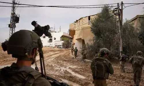 Israeli forces push deeper into Gaza, surrounding Rafah neighbourhood