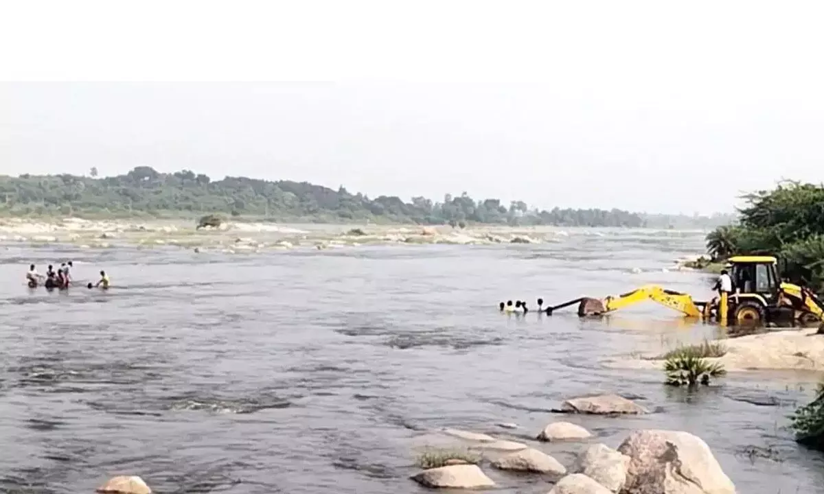 Two Rescued After Being Stranded in Musi River Near Chaitanyapuri Two Rescued After Being Stranded in Musi River Near Chaitanyapuri