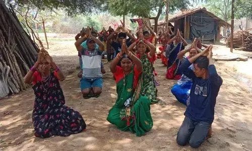 Seeking officials’ attention, tribals kneel in protest