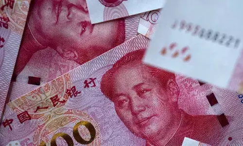 China may devalue Yuan: Economist