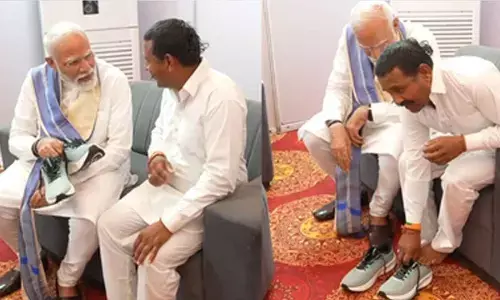 14 years barefoot, a dream fulfilled: PM Modi meets devoted follower, places shoes on his feet
