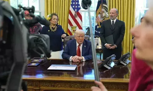 Trump signs memo to extend federal hiring freeze through July: White House