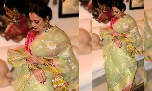 Rekha exudes timeless elegance in a handwoven Banarasi Kora silk saree