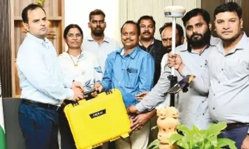 DC hands over DGPS device to survey official