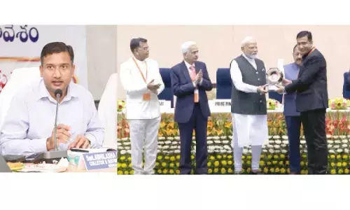 Adilabad Collector Rajarshi gets award