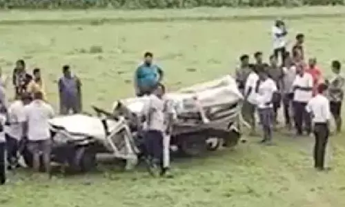 Two cops die as dumper hits van