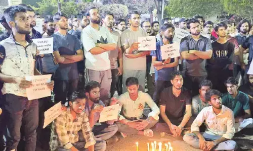 MANUU students hold candlelight march