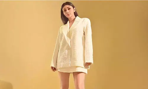 Mouni Roy stuns in white powersuit and shorts