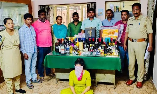 Woman held; illegal liquor stock seized
