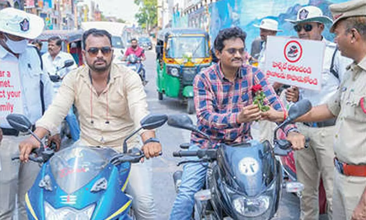 Traffic police hurl roses at motorcyclists
