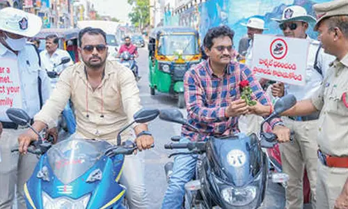 Traffic police hurl roses at motorcyclists