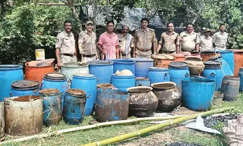 AP Odisha excise staff raids illegal liquor dens