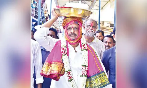 Minister offers silk robes to Lakshmi Narasimha Swamy