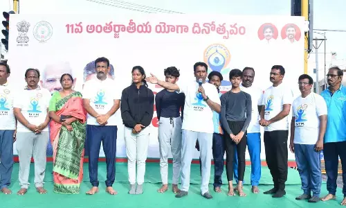 Stay stress-free with yoga, Collector tells staff