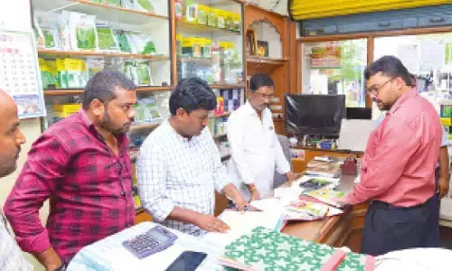 Collector Badavath Santosh inspects seed shops