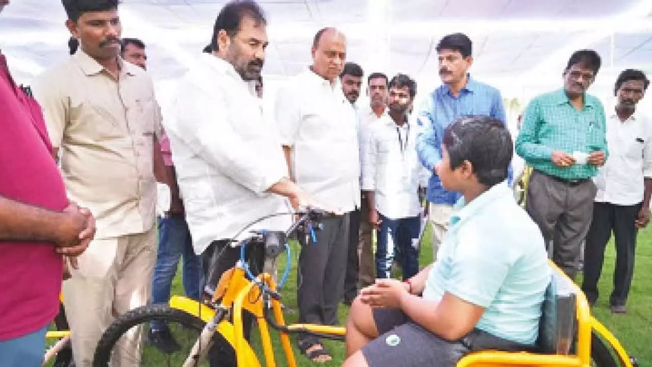 Electric tricycles distributed to disabled Electric tricycles distributed to disabled